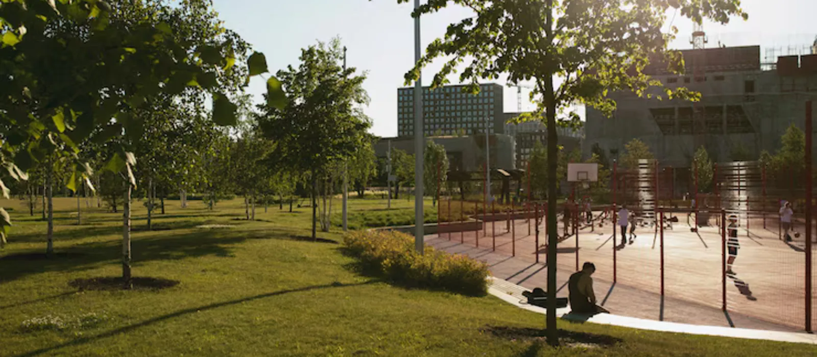 Open lawn and sports court within Prestige Attibele
